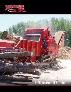 A large, red B-66 horizontal grinder processing large trees.