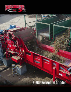The infeed hopper of a large, B-66 E electric horizontal grinder receiving organic materials.