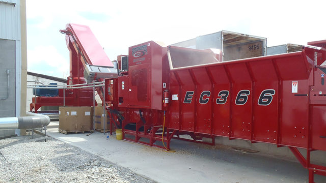 Close up of the side of one of Rotochopper's EC-366 and RMT Hammermill, a multi-stage wood waste processing system.