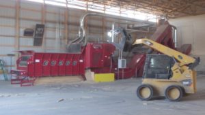 A Rotochopper EC-266 electric horizontal grinder multi-stage grinding system processing into an RMT Hammermill.