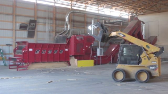A Rotochopper EC-266 electric horizontal grinder multi-stage grinding system processing into an RMT Hammermill.