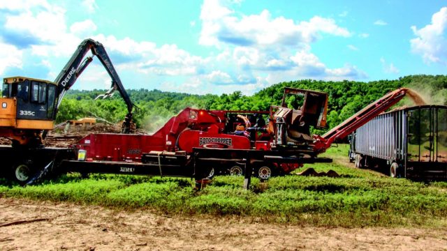 A Rotochopper grinding machine working in conjuction with two other machines to grind feedstock.