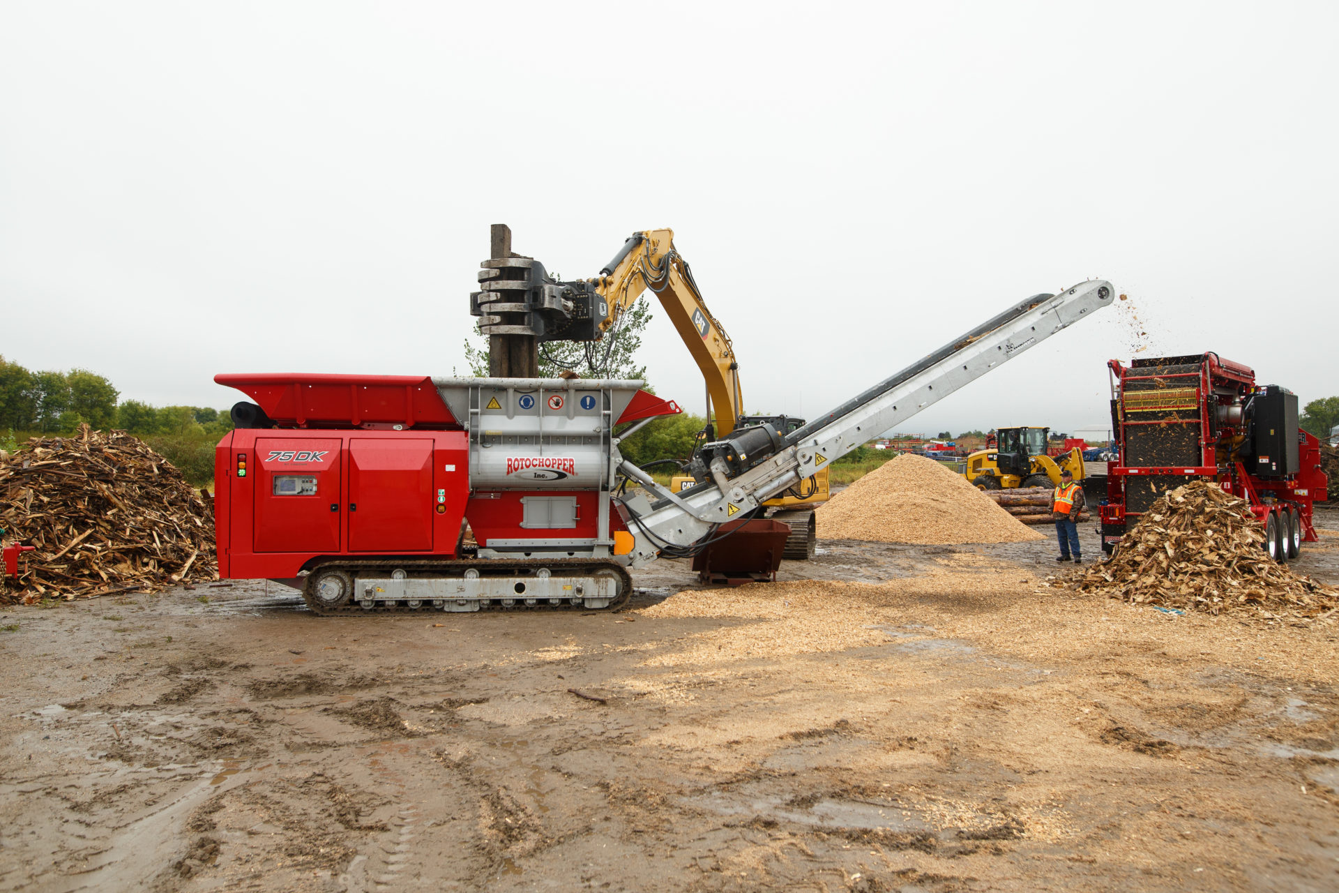 A large Rotochopper 75 DK shredder is outside doing a demonstration for Rotochopper's demo day event.