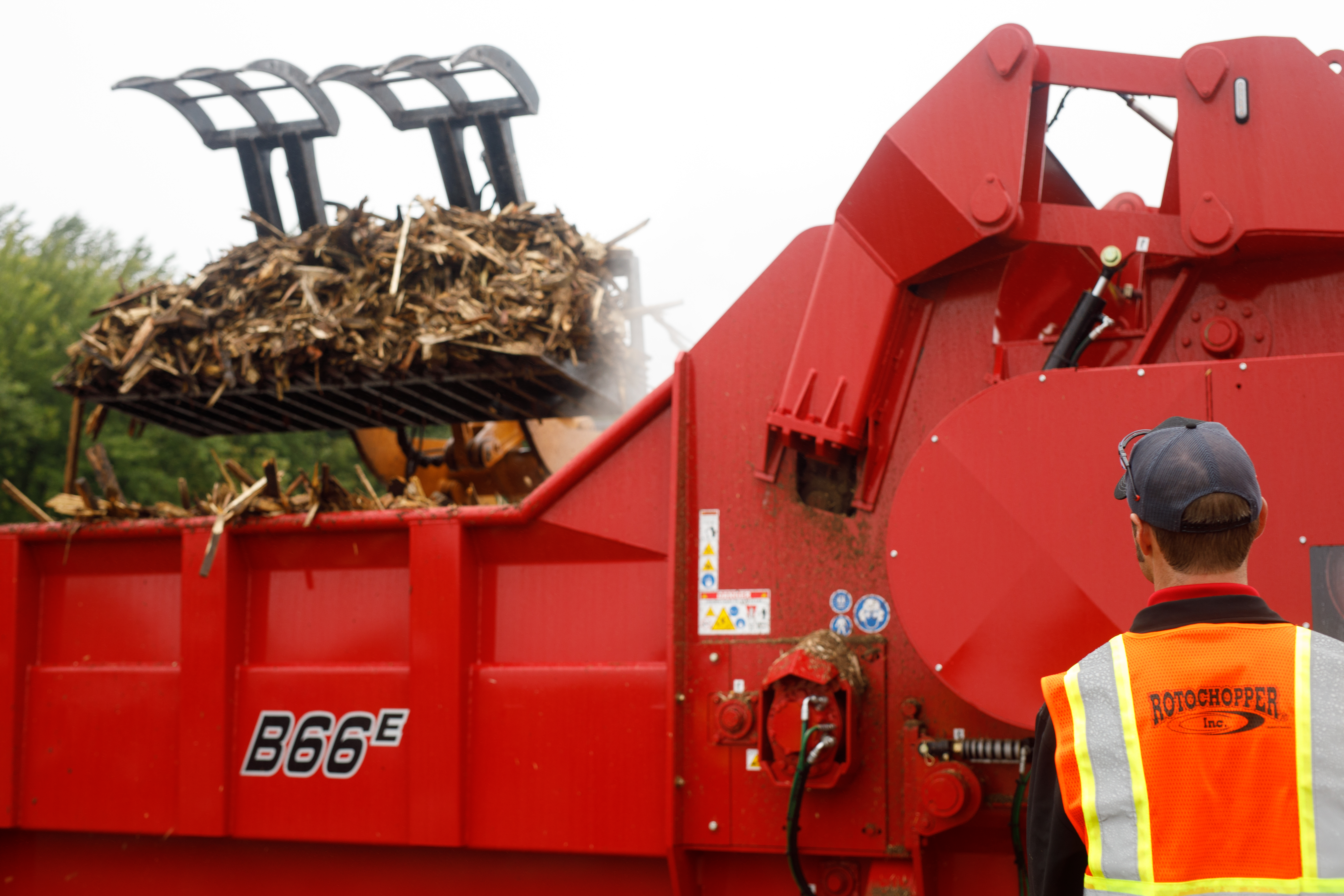 A B66 E series horizontal grinder receivng debris to be ground up for a demonstration at Rotochopper's demo day.