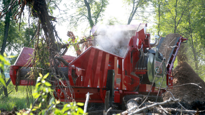 View of one of Rotochopper's machines presenting how it can grind wood waste.