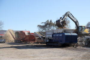 Multiple grinding machines pictured with an excavator at one of Rotochopper's field day events.