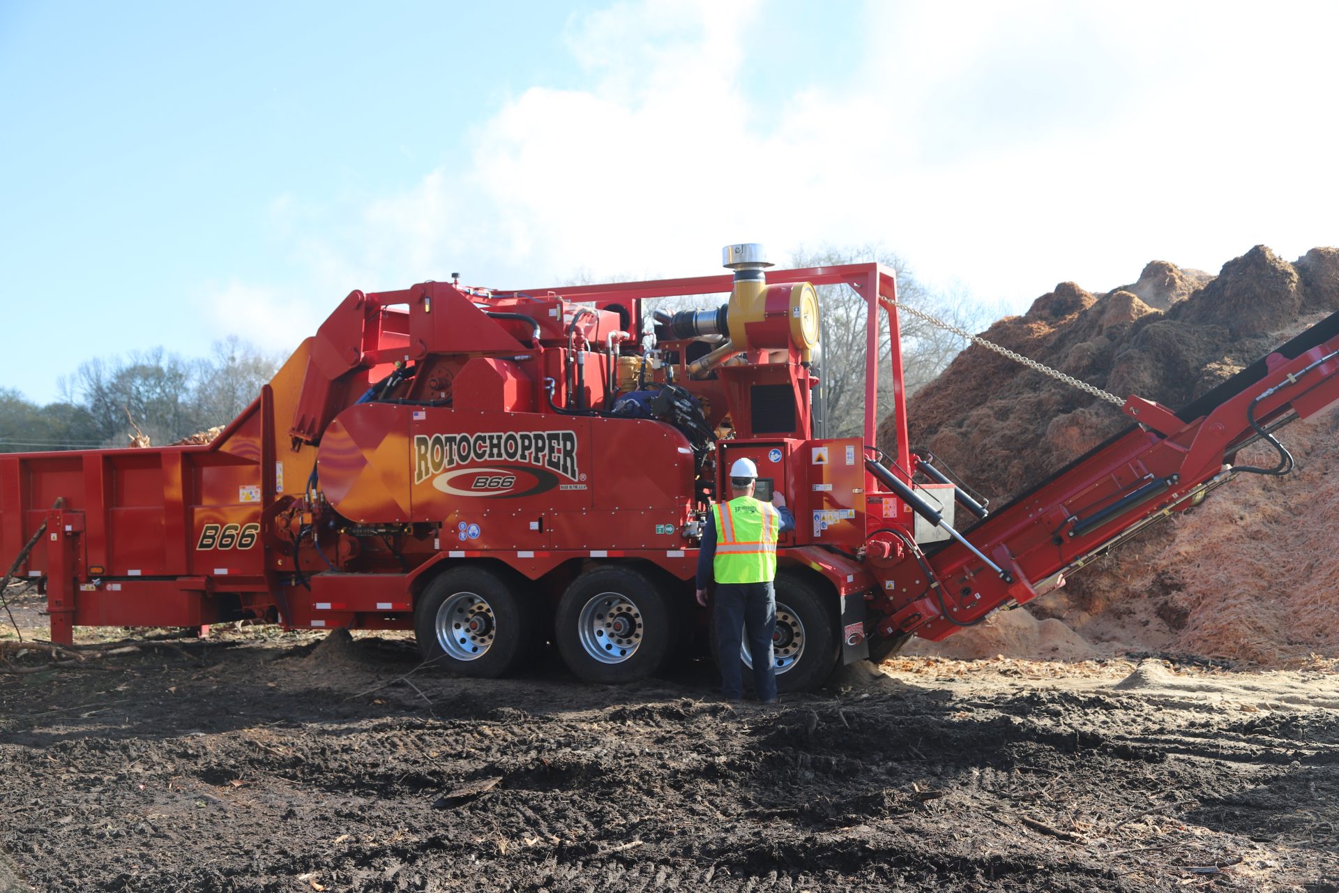 A man with safety gear is shown working with Rotochopper's B66 grinding machine at a grinding site.