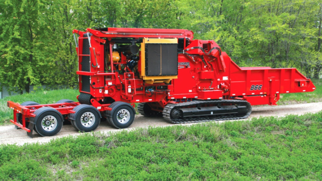 One of Rotochopper's large B66 machines is shown with a large track and dolly system.