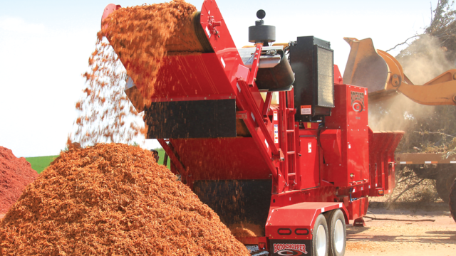 A Rotochopper horizontal grinder producing mulch.