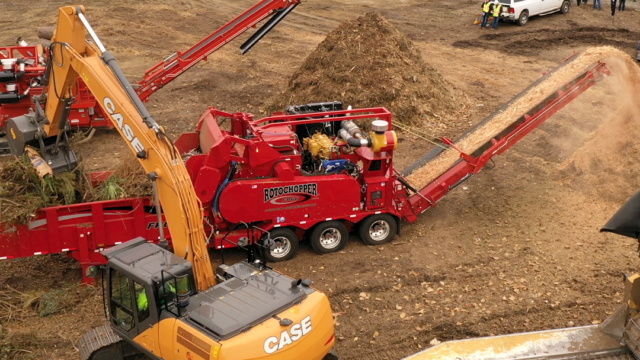 Rotochopper horizontal grinder processing green waste for compost at USCC Demo Day.