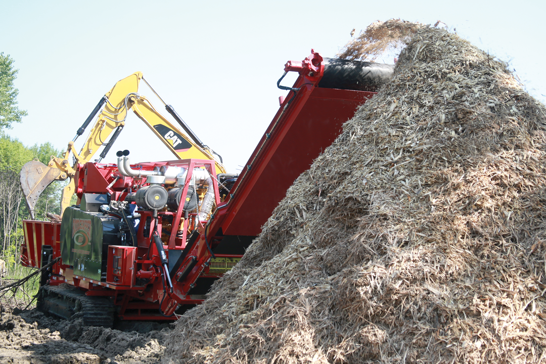 Rotochopper land clearing horizontal grinder grinding wood waste.