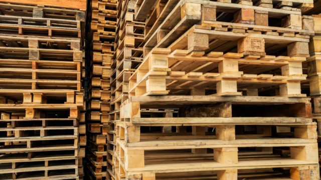 stack-of-wooden-pallet-industrwood pallet at factory warehouse cargo and shipping concept