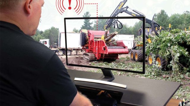 Rotochopper service technician troubleshooting on a computer
