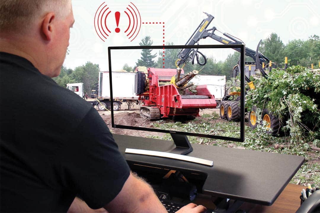 Rotochopper service technician troubleshooting on a computer