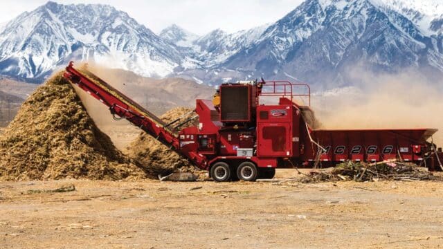 Rotochopper equipment on a job site with mountains in background