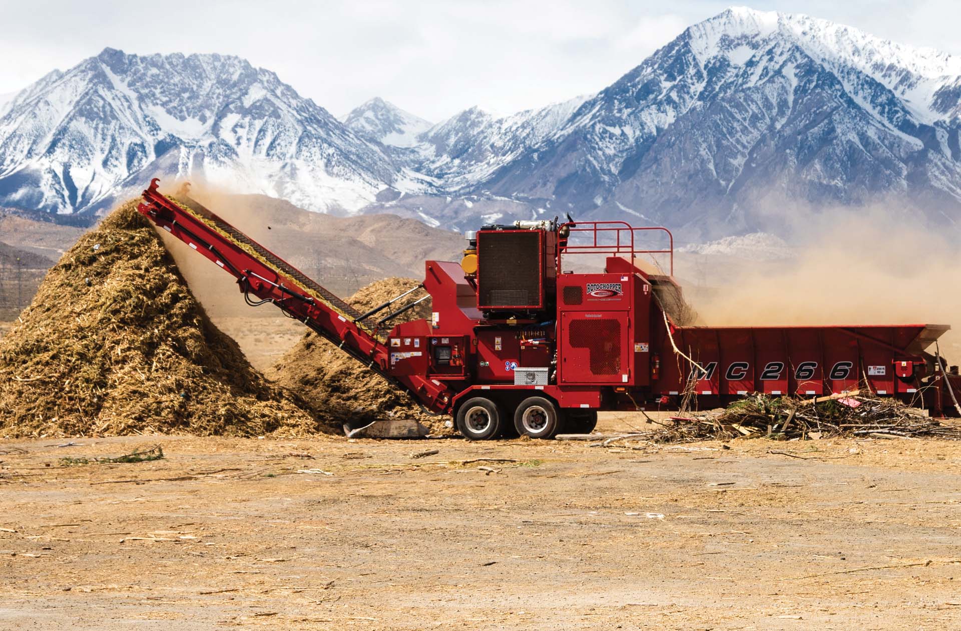 Rotochopper equipment on a job site with mountains in background