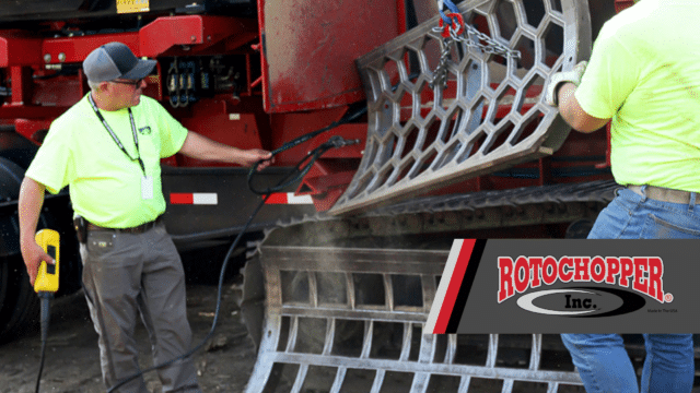 Rotochopper employees removing a grinder screen in a horizontal grinder.