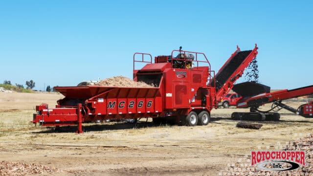 A Rotochopper MC-266 grinding and coloring mulch. The Rotochopper logo is in the bottom right corner.