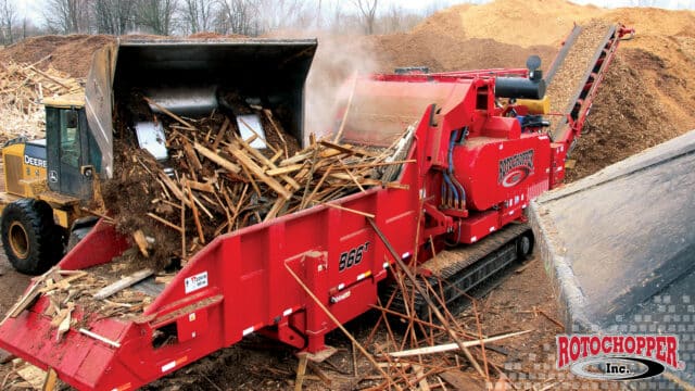 A Rotochopper B-66 grinding construction and demolition waste. The Rotochopper logo is in the bottom right corner.